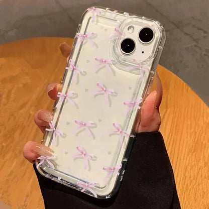 Cute Pink iPhone Case featuring a charming heart bow design on a clear phone cover.